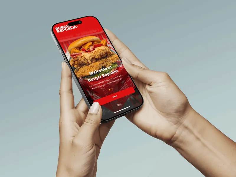 Two hands holding a phone with the Burger Republic ordering app open on its welcome screen.